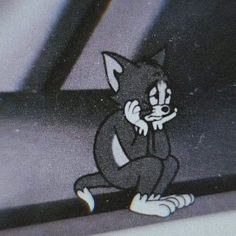 an image of a cartoon cat sitting on the ground