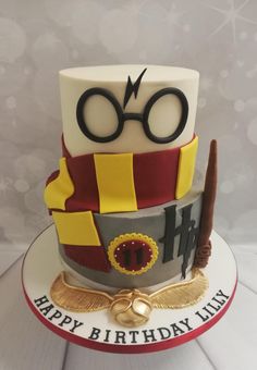 a birthday cake that is shaped like a hat and glasses