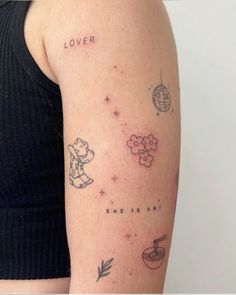 a woman's arm with some tattoos on it