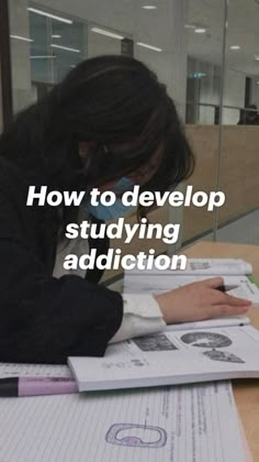 a woman sitting at a table with papers and pens in front of her, reading how to develop studying addition