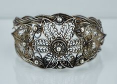 "A spectacular cuff. This Chinese Export cuff is crafted from 900/1000 silver and features an intricate spun wire filigree design. The cuff is in very good condition and is not missing any of the filigree, there it does have a noticeable ding. It is clearly hallmarked \"CHINA SILVER\", weighs 46.1 grams, and test positive for a minimum of 900 silver. The cuff measures approximately 6 inches end to end with a 1 1/2 inch opening and is 1 5/8 inches at the widest point. A fantastic example of Chine Elegant Antique Silver Bangle, Ornate Bangle Cuff Bracelet With Intricate Design, Unique Antique Silver Cuff Bracelet With Intricate Design, Formal Bohemian Cuff Bracelet With Filigree, Unique Filigree Bangle Cuff Bracelet, Traditional Filigree Cuff Bracelet Bangle, Traditional Silver Filigree Bracelets, Victorian Silver Cuff Bracelet With Intricate Design, Unique Silver Filigree Cuff Bracelet