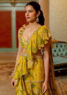 Featuring the lime yellow pre-draped sari in our signature print paired with heavily hand highlighted silk base blouse with kowri shell and our signature belt. Elegant Yellow Pre-draped Saree With Traditional Drape, Yellow Silk Pre-draped Saree For Reception, Yellow Georgette Blouse With Traditional Drape, Designer Pre-draped Yellow Saree, Yellow Pre-draped Designer Saree, Yellow Designer Wear Pre-draped Saree, Elegant Designer Yellow Blouse Piece, Silk Pre-draped Saree For Summer Reception, Elegant Yellow Blouse Piece For Summer