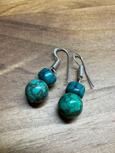 blue and green turquoise-look dangle bead earrings. Handmade in western Nepal by members of a women's literacy project. All proceeds benefit the literacy project. Turquoise Beaded Drop Earrings, Adjustable Green Beaded Earrings With Natural Stones, Artisan Green Beaded Earrings Nickel Free, Green Southwestern Beaded Earrings For Gift, Southwestern Green Beaded Earrings For Gift, Green Beaded Dangle Earrings With Natural Stones, Hypoallergenic Turquoise Beaded Dangle Earrings, Green Southwestern Beaded Earrings Gift, Southwestern Green Earrings With Dangling Beads