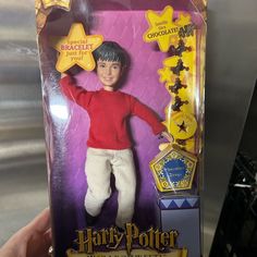 a toy harry potter doll in its packaging