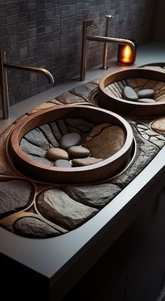 two sinks made out of rocks and pebbles