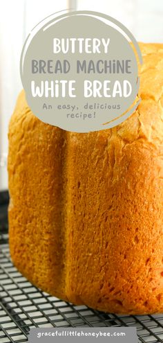 a loaf of bread sitting on top of a cooling rack with the words buttery bread machine white bread