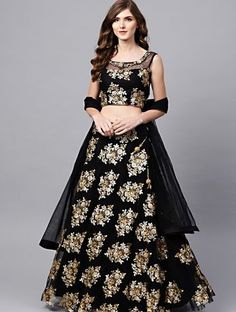 Make a statement by wearing this black color lehenga with zari and glittery dual sequins embroidered floral work in net material comes with a double layer attached can-can. Color: Black Silhouette / Shape: A line Wash Care: Dry Clean Only Prize:-₹4,249.00 Black And Golden Lehenga, Black Sequin Lehenga, Sequins Lehenga, Netted Blouse Designs, Mirror Work Lehenga, Net Blouse, Net Blouses