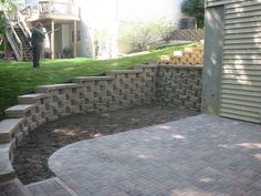 a brick patio with steps leading up to it