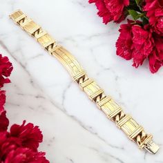 About This Piece: The Authentic Tiffany & Co Atlas Link Bracelet, crafted in 18k yellow gold, dates back to 1995. Featuring the iconic Roman numeral motif, this elegant piece showcases a bold, timeless design with interlocking links. It reflects Tiffany's classic style, making it a luxurious addition to any jewelry collection. Metal: 18k Yellow Gold Measurements: Length: 7" Width: 13mm Weight: 66.8 grams Hallmarks: Tiffany & Co. 750 Italy 1995 T3576redd Designer Yellow Gold Jewelry Stamped 14k, Designer 14k Stamped Yellow Gold Jewelry, Luxury Hallmarked Yellow Gold Diamond Bracelet, Designer Yellow Gold Polished Bracelet, Luxury Formal Rectangular Diamond Bracelet, Designer Yellow Gold Chain Bracelet For Formal Occasions, Designer 14k Gold Jubilee Bracelet, Designer 14k Gold Bracelet With Jubilee Style, Luxury Yellow Gold Jubilee Bracelet