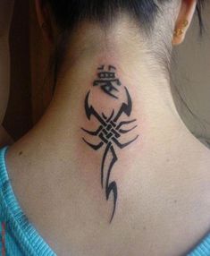 a woman with a tattoo on her neck and behind the neck is a small scorpion