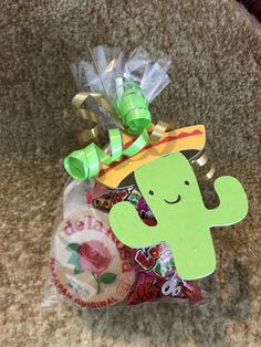 a bag filled with assorted candy on top of a carpet