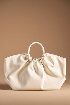 Polyurethane; polyester lining Removable, adjustable crossbody strap One inner zip pocket One inner slip pocket Magnetic closure Imported | Patent Faux-Leather Half Moon Bag by Anthropologie in Beige, Women's, Polyester/Polyurethane Anthropologie Bag, Anthropologie Bags, Moon Silhouette, Moon Bag, Adjustable Bag, Orange Bag, Beaded Bags, White Bag, Half Moon