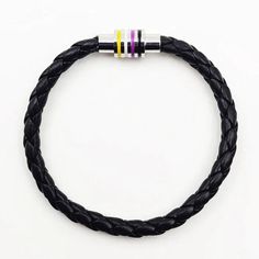 Show off your Nonbinary pride in style with this stunning braided leather rope-style bracelet. Made with genuine leather and a handcrafted stainless steel silver magnetic clasp, with vibrant Enby Pride colored enamel stripes. Magnetic hidden safety-clasp 7.5 inches (19 cm) inner circumference around wrist Non Binary Pride, Pride Colors, Non Binary, Magnetic Clasp, Braided Leather, Fashion Bracelets, Rope Bracelet, Genuine Leather, Stripes