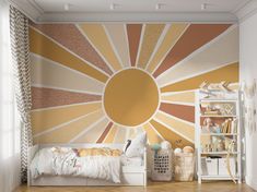 a bedroom with a sunburst painted on the wall next to a white bed