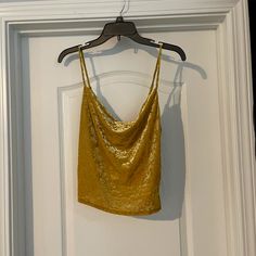 Yellow Urban Outfitters Camisole. Super Cute On!! Never Worn. The Design Is Textured (Looks/Feels Velvety). Size Medium. Casual Gold Tank Top For Party, Yellow Urban Outfitters Crop Top, Urban Outfitters Sleeveless Tank Top For Party, Urban Outfitters Tank Top For Summer Party, Yellow Tank Top For Night Out In Summer, Yellow Crop Top For Night Out In Spring, Cowl Neck Cami, Blue Cami, Green Corset