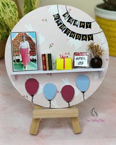 a birthday card is displayed on a shelf