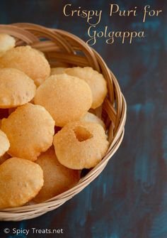 crispy puri for golapa in a basket on a blue tablecloth