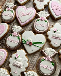 many decorated cookies are arranged on a table