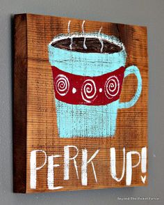 a wooden sign that says perk up with a coffee cup painted on it's side