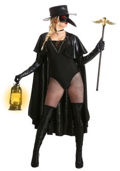 a woman dressed as a witch holding a lantern and wearing a black outfit with sheer stockings