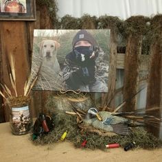 a photo of a man and his dog are on display in front of a fence