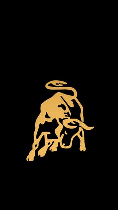 an image of a bull that is in the dark with gold on it's face