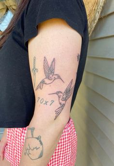 a woman with a tattoo on her arm