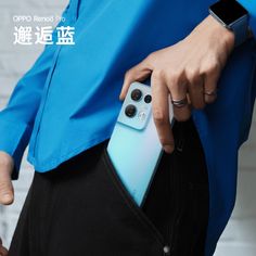 a person holding an electronic device in their pocket