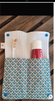 the toothbrush holder is made out of fabric and has two toothbrushes in it