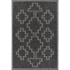 a black and white rug with an intricate design on the bottom, in front of a white background