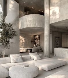 a living room filled with white couches next to a tall tree in front of a spiral staircase