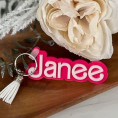 Personalized these name keychains made from Pink Capri backer with White letterings for use on backpacks, luggages, diaper bags, sports bag, gym bags or gift them for bridesmaids. These name tags has multi purpose options and is a perfect back to school gift for girls.Product Details Tags are made with 3MM acrylic backer and stacked with 3MM coloured acrylic Each Tag will be approximately 4" wide and the height will vary based on the nameKeychain hardware included with lobster clasp and coordina Customized White Keychains For Everyday Use, Trendy Personalized White Keychains, Trendy White Personalized Keychains, Rectangular White Keychain For School, Personalized Pink Keychains For Personal Use, Personalized White Keychain For School, Personalized Pink Keychains For Gifts, Customized Pink Keychains For Everyday Use, Custom Name Pink Keychains For School