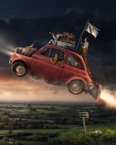 a red car with people on top flying through the air