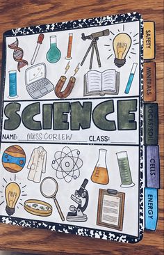 a book with science written on it and some other items around the page in front of it