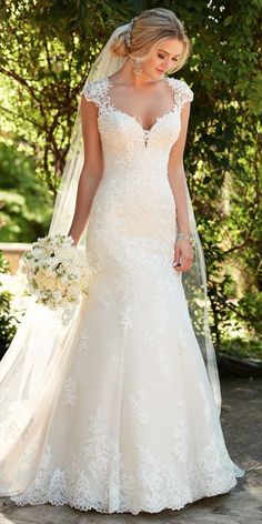 a woman in a wedding dress holding a bouquet