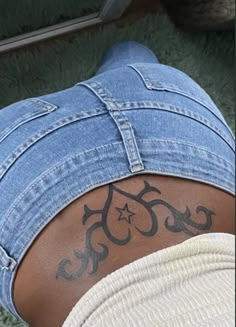 a person with a tattoo on their back