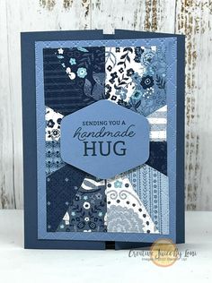 a handmade hug card with blue and white fabric on the front, featuring an image of