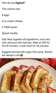 a white plate topped with french toast and strawberries