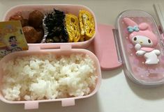 a pink hello kitty lunch box with rice and meat