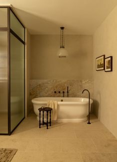 a bathroom with a large tub and walk in shower