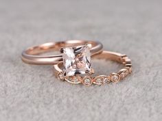 two rose gold wedding rings with a princess cut diamond