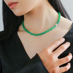 This elastic necklace combines traditional Chinese aesthetic elements with modern style. Featuring sparkling zirconia beads and soothing green agate beads, this necklace exudes elegance and sophistication. The intricate bead arrangement creates a harmonious balance between vintage charm and modern style. Metal: Recycled Sterling Silver Gemstone: Cubic Zirconia,Green Onyx Diameter: Long 760mm,Short 440mm Weight: Long 42g,Short 24g Elegant Jade Beads As Gift, Elegant Jade Crystal Necklaces With Round Beads, Elegant Green Onyx Beaded Necklaces, Elegant Beaded Jade Crystal Necklaces, Elegant Jade Gemstone Beads, Elegant Jade Crystal Necklace With Round Beads, Elegant Beaded Jade Crystal Necklace, Elegant Silver Jade Beaded Necklace, Elegant Green Single Strand Crystal Necklaces