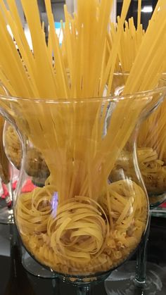 some pasta in a glass bowl on a table