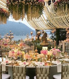 an image of a table set up with flowers and candles for a wedding or special event