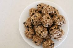 a white plate filled with chocolate chip energy bites