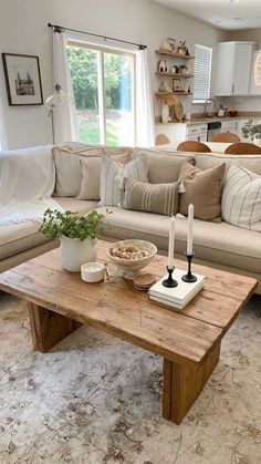 a living room filled with furniture and a wooden table