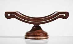 a wooden object sitting on top of a table