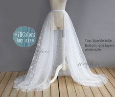 a white wedding dress on a mannequin with the words top - sparkle tulle bottom one layer