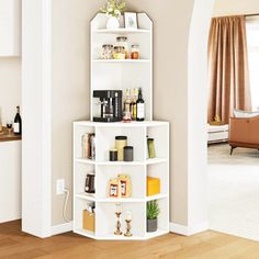 a corner shelf with bottles and other items on it in a living room next to a doorway