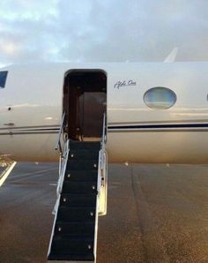 an airplane with stairs leading up to the door